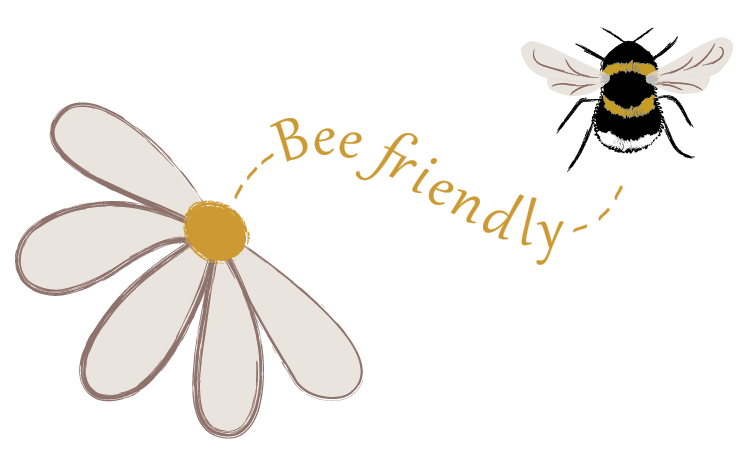 flower with 'Bee friendly' text curving toward a black/white/yellow bumblebee. Bee Friendly. ©2020 Outspoken Images by Marie Warner Preston