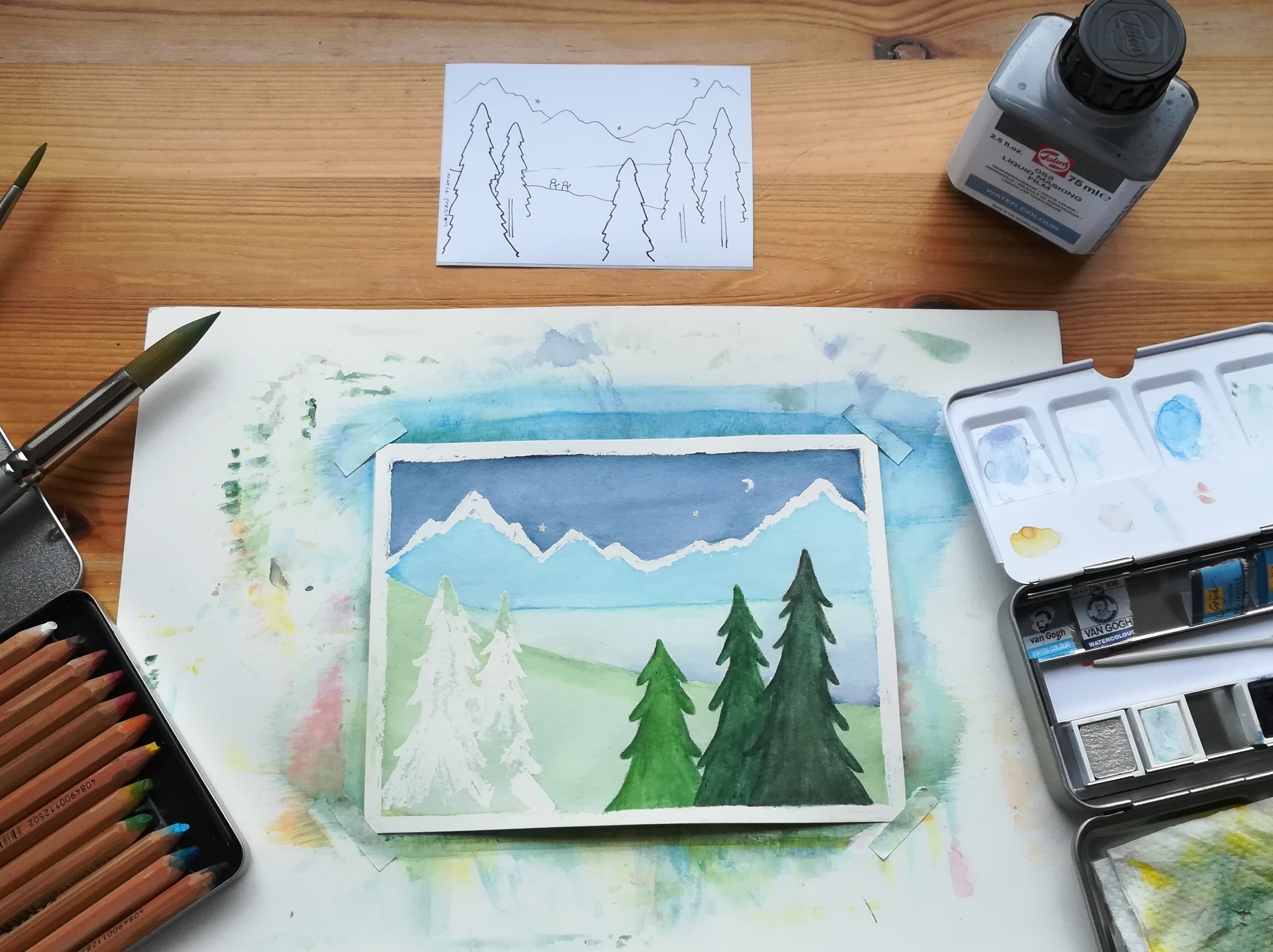 Blue on Blue: Nearly finished. Watercolour painting with blue sky, mountains, lake, and green trees. Surrounded by pen illustration, masking fluid, pencils, paintbrushes, paint