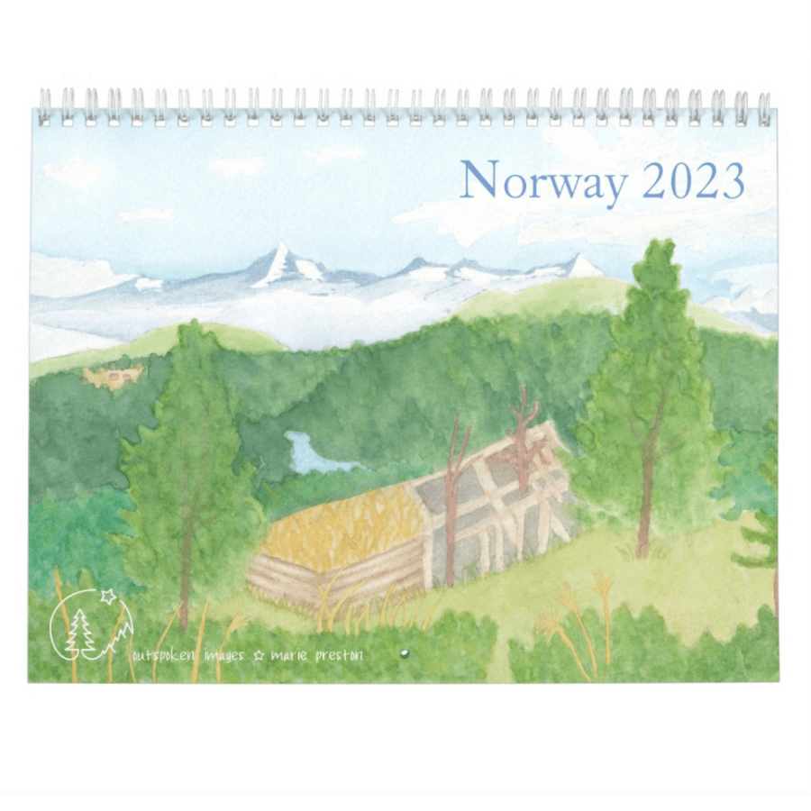 2023 Norway wall calendar: Old barn among trees and grass, snow-covered mountains in background. ©2022 Marie Preston